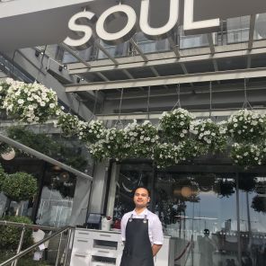Christian Matagi standing proudly on the steps of Soul graduate NZ Cert in Food and Beverage Level 4